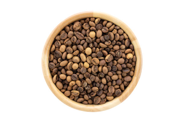 istock Top view of hand roasted light coffee beans robusta in bowl isolated on white background 1248663116
