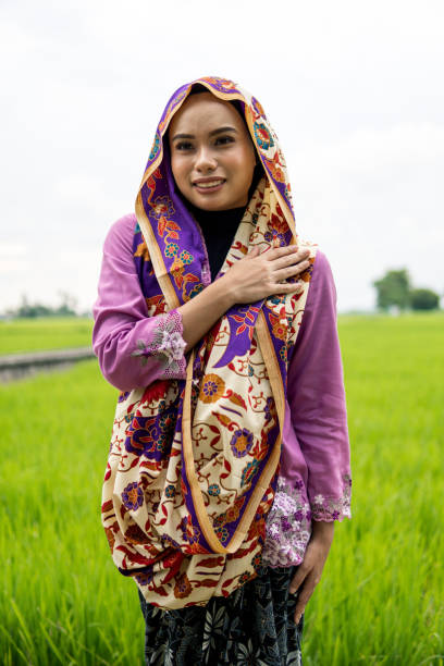istock Young women standing and showing gestures paddy field 1248663578