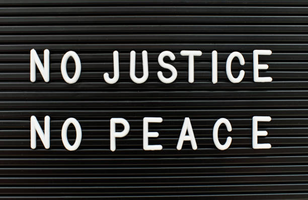 No justice no peace written on letter board. Police brutality concept. No justice no peace written on letter board. police brutality photos stock pictures, royalty-free photos & images