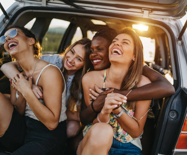 istock Female friends having fun on road trip 1248670351