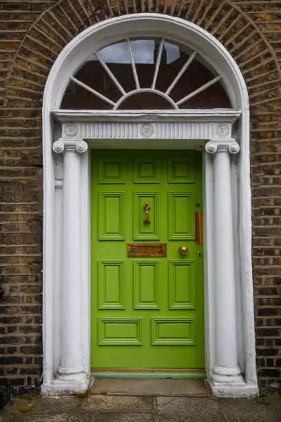 Photo of Colorful georgian doors in Dublin, Ireland. Historic doors in different colors painted as protest against English King George legal reign over the city of Dublin in Ireland