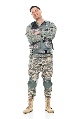 One person of aged 30-39 years old who is tall person with black hair caucasian male armed forces standing in front of white background in the us military wearing military uniform who is smiling and showing patriotism