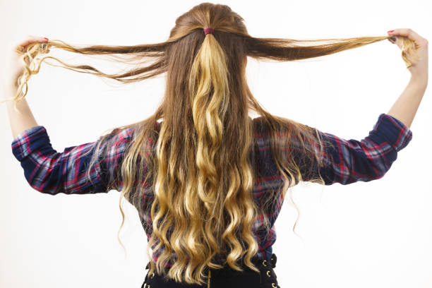 istock Back view on woman curly hair 1248671725