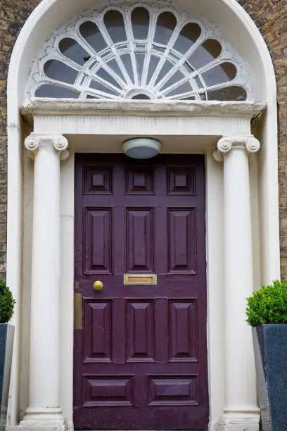 Photo of Colorful georgian doors in Dublin, Ireland. Historic doors in different colors painted as protest against English King George legal reign over the city of Dublin in Ireland