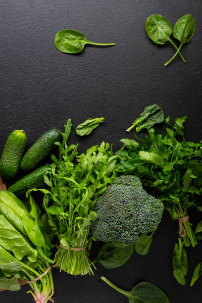 istock Fresh organic vegetables on black cooking table, top view 1248673102