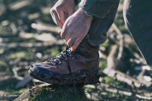 istock Hiker tying laces on boots 1248674161