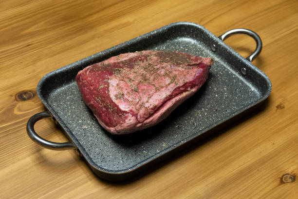 raw steak on pan stock photo