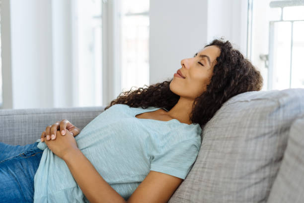 istock Tired young woman taking a short daytime nap 1248674861