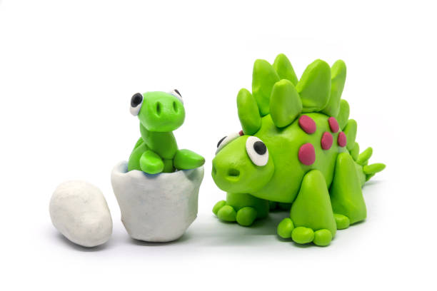 istock Play dough Stegosaurus and egg on white background 1248675069