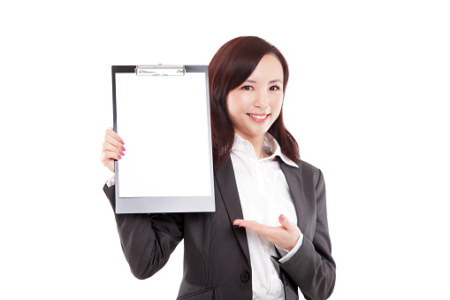 Beautiful Asian Businesswoman Presenting with Blank Clipboard on White Background.