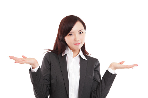 Attractive Young Asian Businesswoman Looking at Camera with Both Palms Opened on White Background.