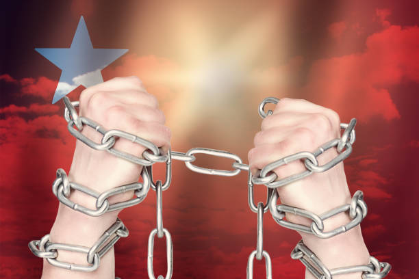 istock Two hands shackled a metal chain on USSR flag. Freedom concept 1248676263