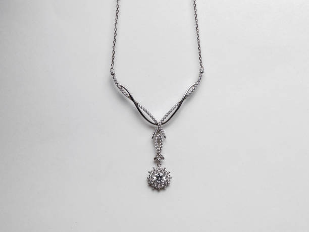 istock Elegant silver necklace with precious stones on a white background 1248681612