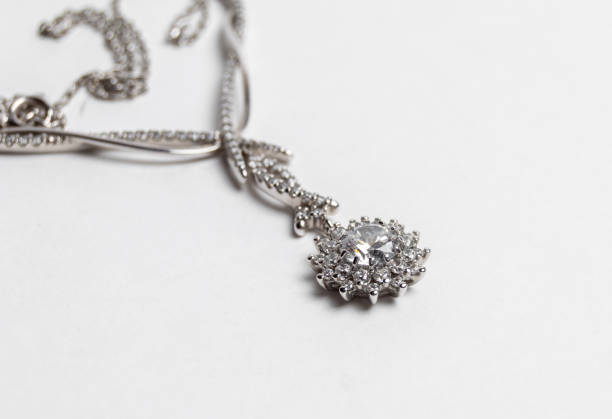 istock Elegant silver necklace with precious stones on a white background 1248681644