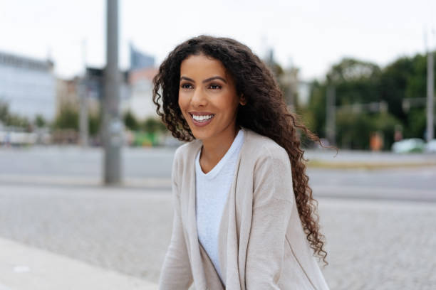 istock Friendly young African woman standing watching 1248683026