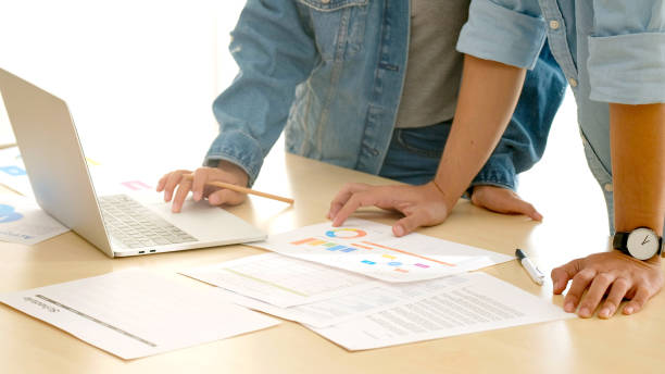 istock Young creative design meeting brainstorm ideas to plan and develop project together in office, Close up two hand of small business startup coworker, colleagues working  for the small business solution, People in office lifestyle 1248683338