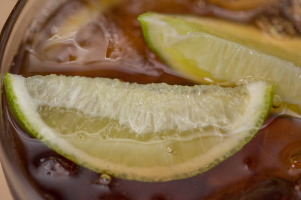 cuba libre cocktail with lemon