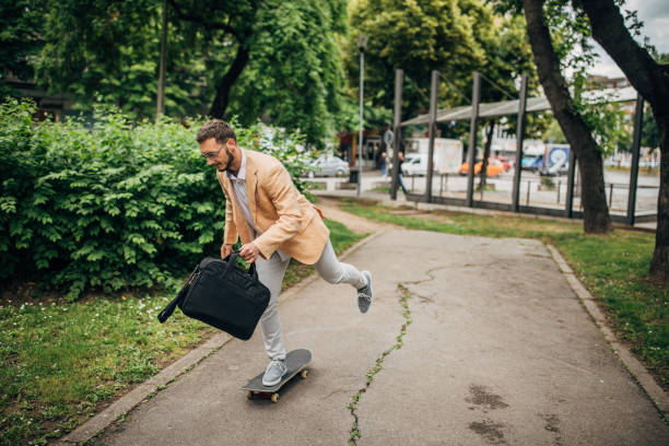 istock One young businessman commuting to work with skateboard 1248683460