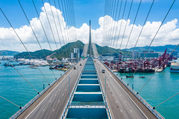 istock Bridge in Hong Kong and Container Cargo freight ship 1248683530