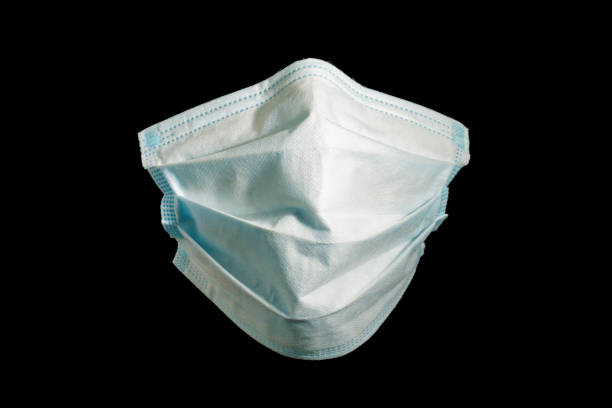 istock surgery protection mask against viruses, like coronavirus, on black background 1248685716