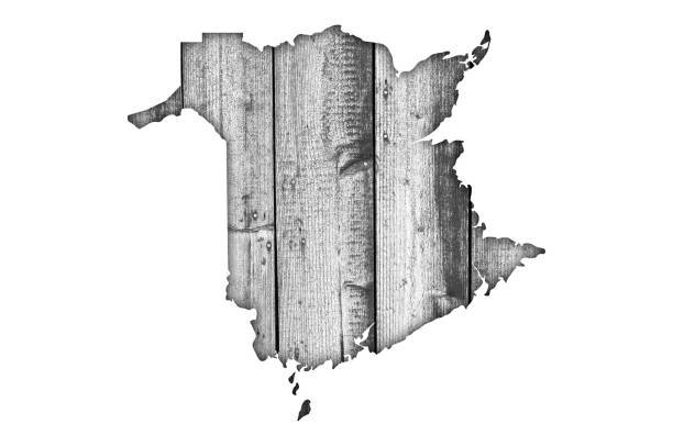 istock Map of New Brunswick on weathered wood 1248686540