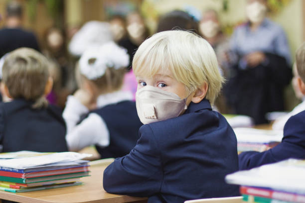 Child boy student in protective mask, back to school Child boy student in protective mask, back to school primary election photos stock pictures, royalty-free photos & images