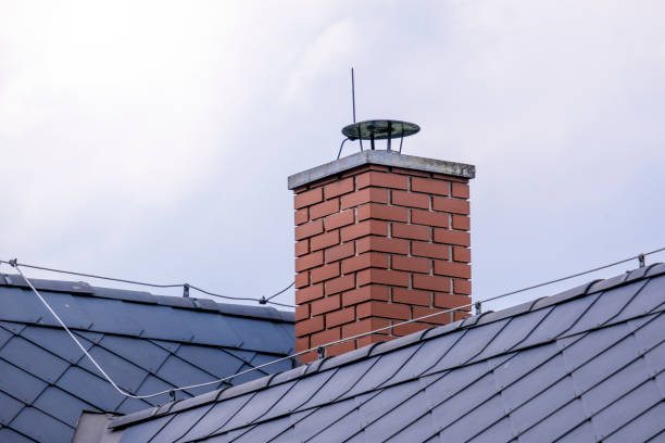 istock repaired brick chimney in a forest hut with dark roofing 1248687957