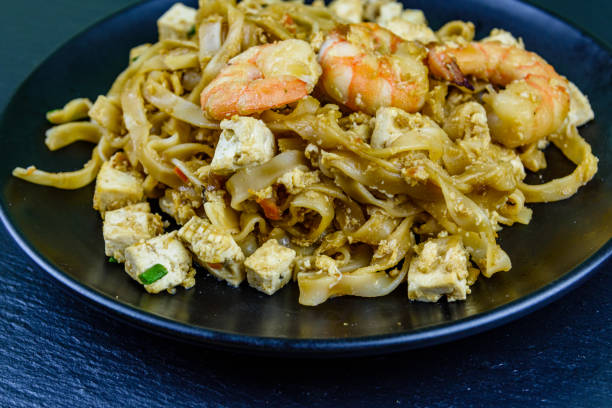 istock Black plate with pad thai on a slate board 1248689435