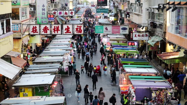 Many People Walking Down The Streets Where Several Stalls Lining Up During A Festival In Hong Kong - Timelapse