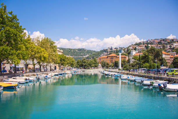 Rijeka, Croatia - July 18 2018: Rjecina river with the Liberation Monument, boats and view over the city of Rijeka, Istrian Peninsula in Croatia