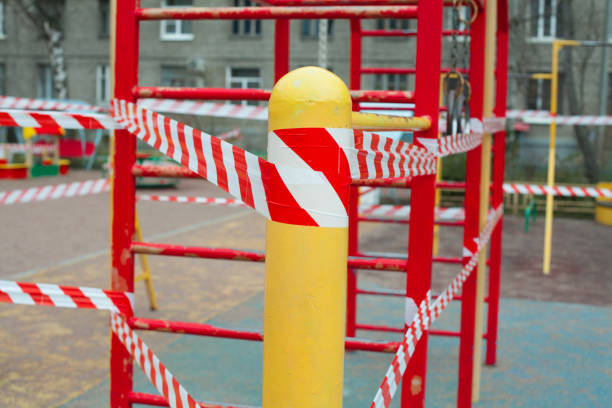 istock Warning tape on closed playground, quarantine concept 1248691350