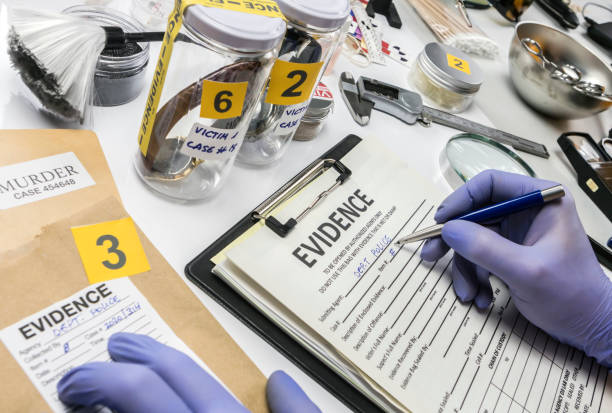 specialized criminalistic police work in laboratory collecting data and evidence of a murder, conceptual image - csi imagens e fotografias de stock