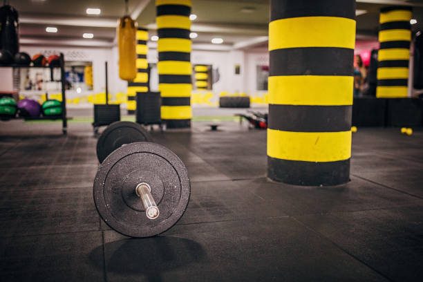 istock Barbell in the gym 1248691449