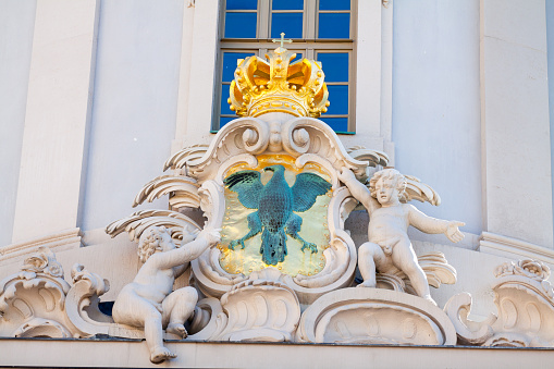 Emblem and golden crown at old town hall Altes Rathaus Potsdam, baroque architecture from 1753-1755