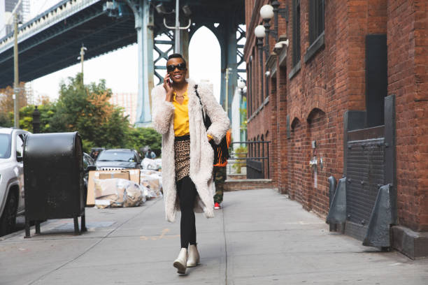 istock Woman in Dumbo - New York talking on mobile 1248693280