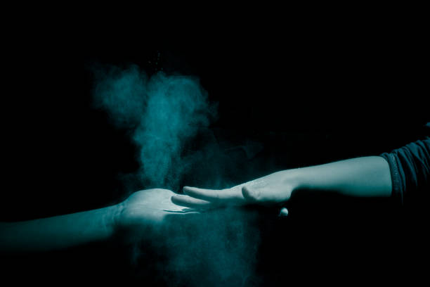 istock Concept of coronavirus germs passing between people in visible infection particles on hands 1248693396