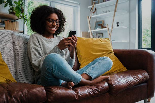 istock Gorgeous woman texting on smartphone and smiling with joy 1248693776