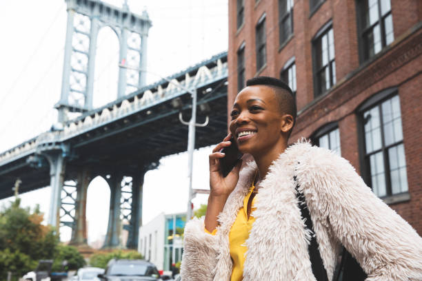istock Woman in Dumbo - New York talking on mobile 1248694028
