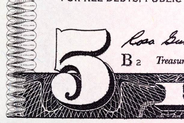 istock Five U.S. dollar bill close-up shot. American money on macro. 1248694795