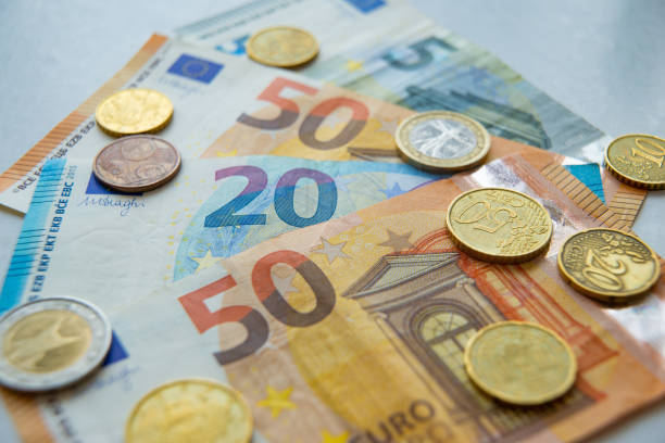 istock Euro coins and banknotes 1248695054