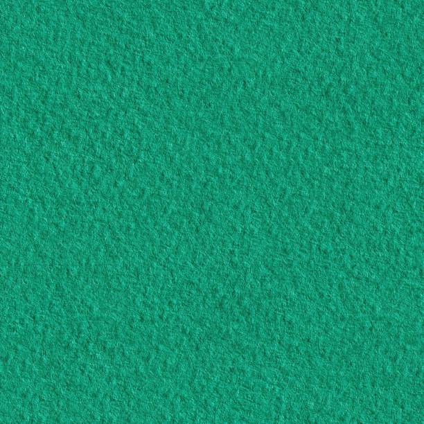 istock Textured dark green paper as background. Seamless texture. Tile ready. 1248696184