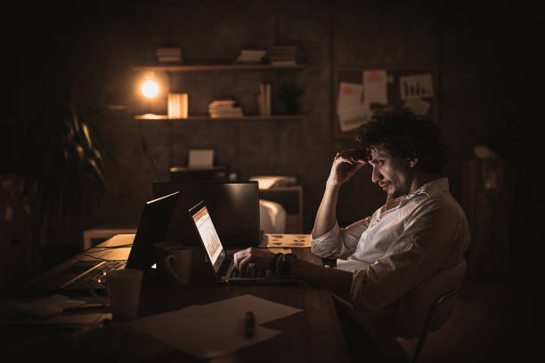 istock One young businessman working late at night in office 1248697317