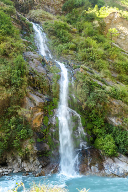 istock Tal - A tall waterfall flowing down the Himalayan slopes 1248697362