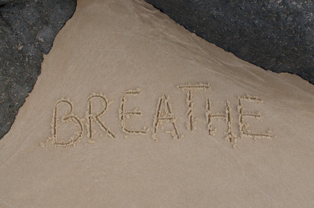 istock Breathe inscription drawn in the sand 1248697483