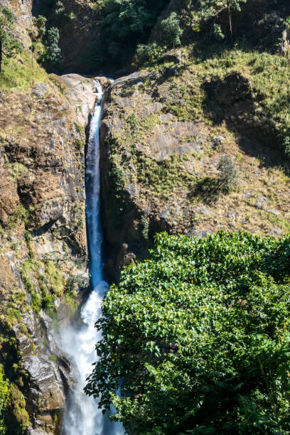 istock Tal - A tall waterfall flowing down the Himalayan slopes 1248697523