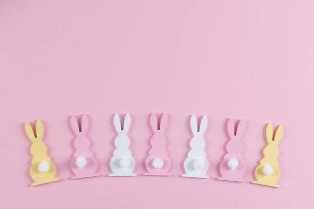 istock Easter bunnies on bright pink background, easter greeting card, top view with copy space 1248701197