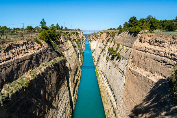 istock blue water flowing near rocky hills with bridge 1248701309