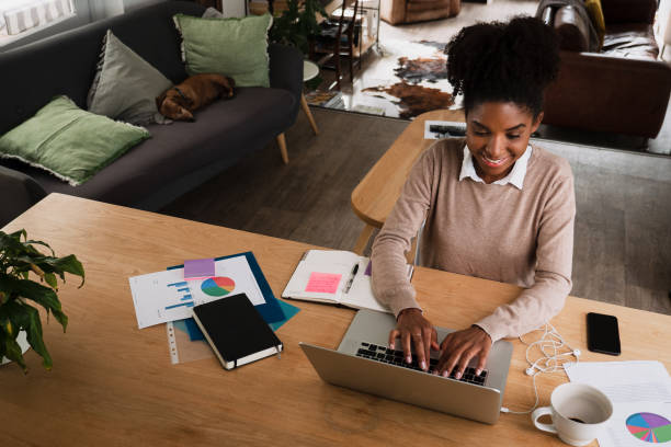 Young professional woman working and studying from home