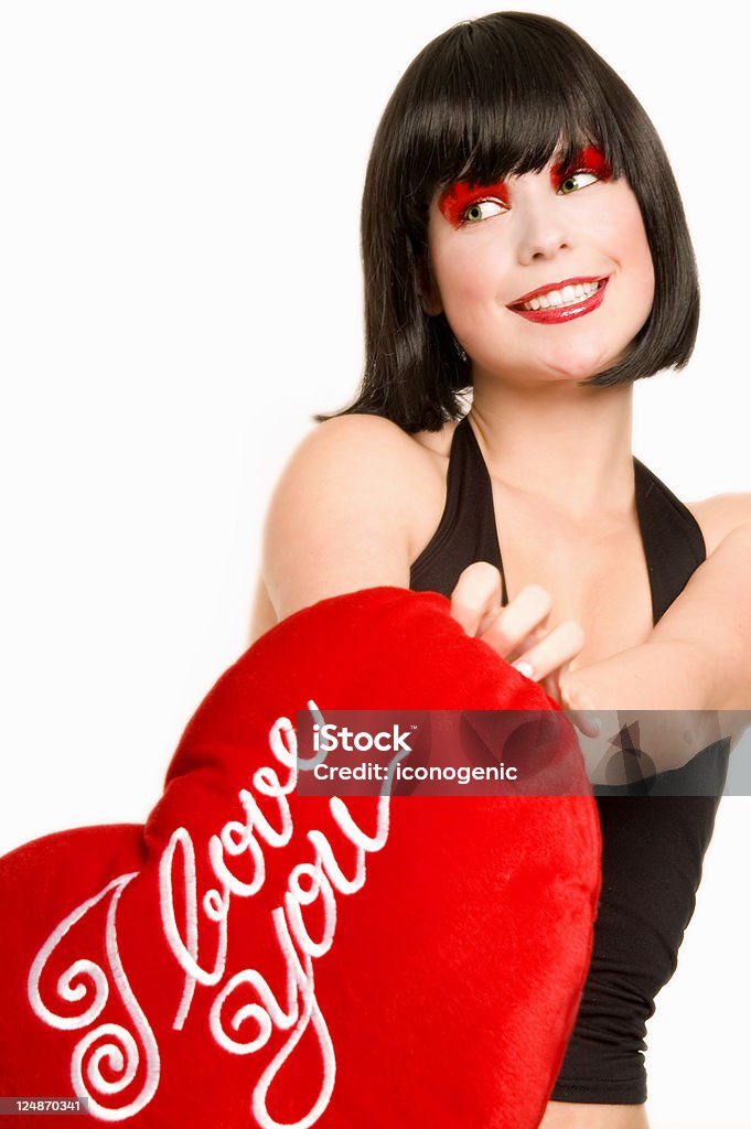 I Love You - 3 Girl holding a red heart-shaped pillow with "I love you" text. Adult Stock Photo