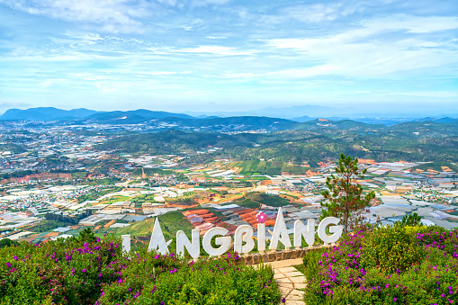 Da Lat, Vietnam - April 27th, 2020: Landscape top Mount Langbiang, below are vegetable gardens, flower farming food supply for whole region, place of excursions, central highlands in Da Lat, Vietnam